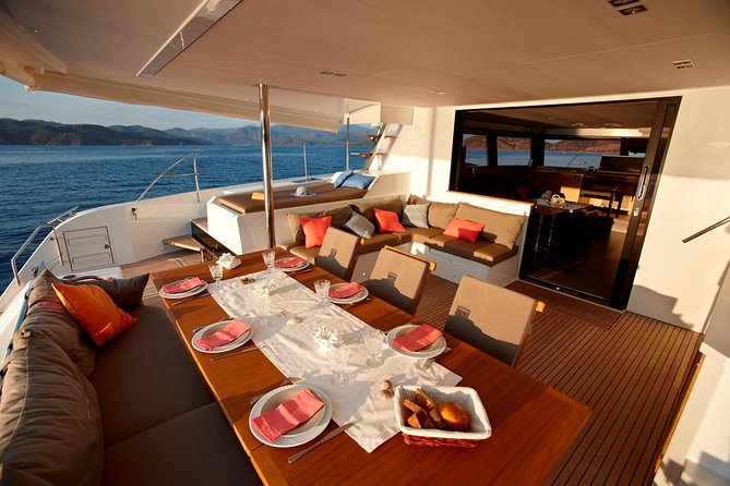 Santorini Luxury Catamaran Day Cruise with BBQ,drinks,transfer - Sea views of the Ancient Lighthouse from the water