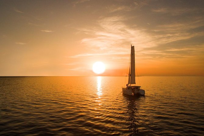 Santorini Luxury Catamaran Sunset Cruise with BBQ, Drink and Transfer - Sailing by the volcano and Palea Kameni: the slow part you’ll enjoy