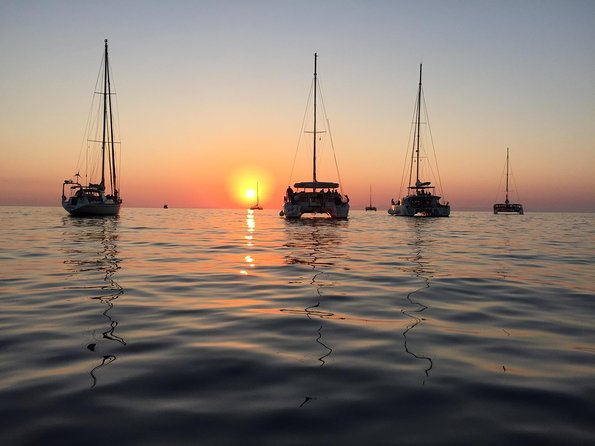 Santorini Luxury Catamaran Sunset Cruise with BBQ, Drink and Transfer - Hot springs swim: warm water near the volcano, no ticket stress