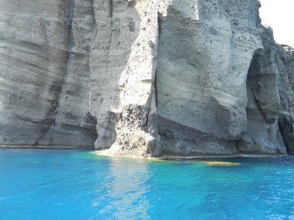 Santorini Luxury Catamaran Sunset Cruise with BBQ, Drink and Transfer - Red Beach snorkeling: short swim time, big color payoff