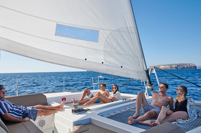 Santorini Platinum Catamaran Cruise with Meal, BBQ and Open Bar - Sailing Time to White Beach and the Akrotiri Lighthouse View