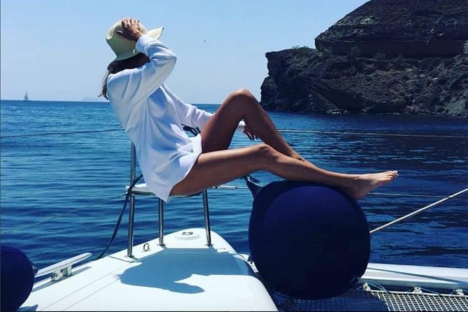 Santorini Platinum Catamaran Cruise with Meal, BBQ and Open Bar - Stop 3: Santorini Volcano Hot Springs With Volcanic Caves and Beaches