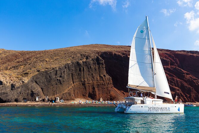 Santorini Private Catamaran Cruise with BBQ, Open Bar & Transfers - Red Beach Photos, Then Off to the Boat-Only White Beach