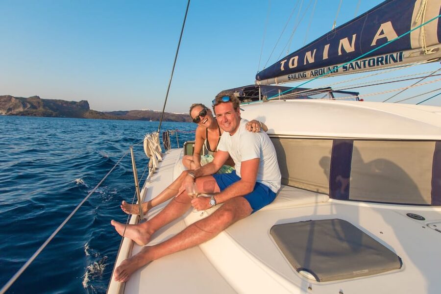 Santorini: Private Catamaran Cruise with Food & Drinks - Crew style: captain-led sailing plus a chef/host who keeps things moving