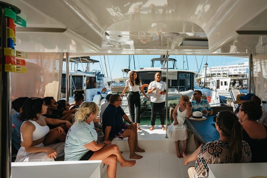 Santorini: Sailing Catamaran Cruise with BBQ and Drinks - Red Beach and White Beach: easy swims, fast scenery, good photo timing