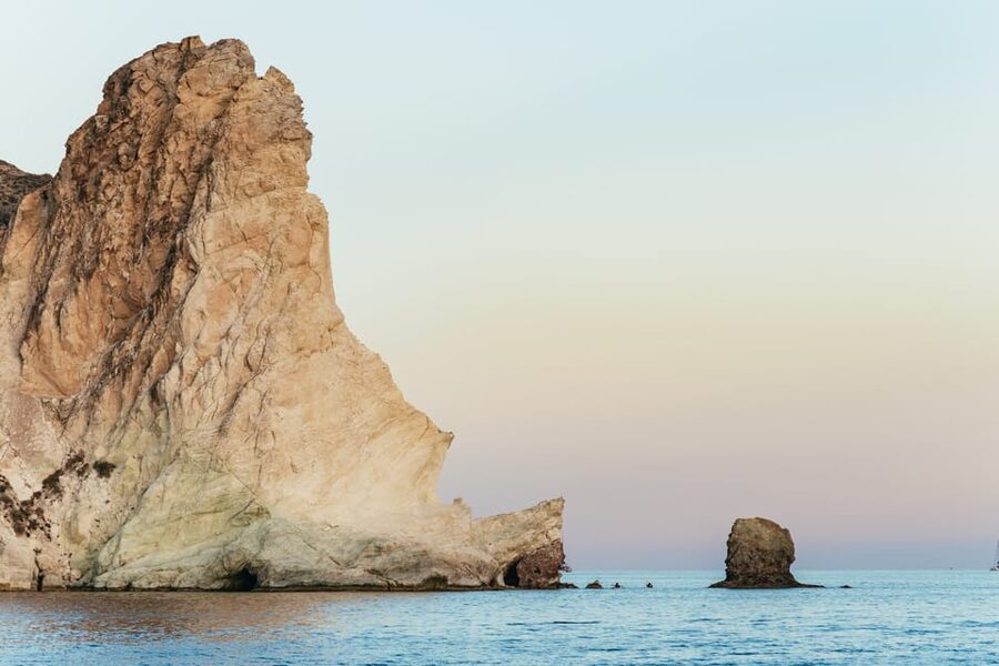 Santorini: Sailing Catamaran Cruise with BBQ and Drinks - Caldera passes: Indian Rocks and the Venetian Lighthouse from the water