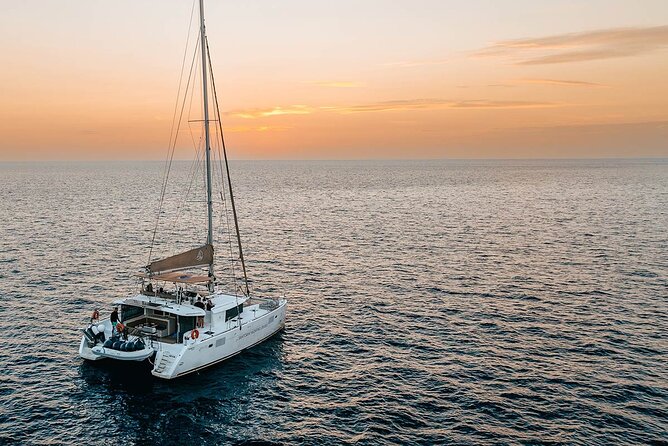 Santorini Sunset Sailing Cruise: Dinner, BBQ, Open Bar, Transfers - Volcano Hot Springs: Caldera Waters in a Tight One-Hour Stop