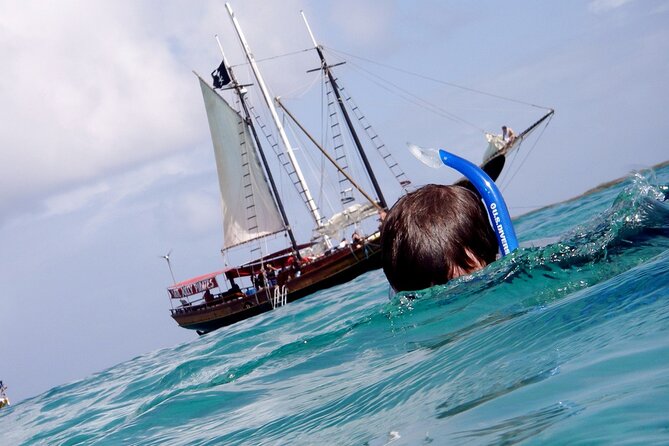 Set Sail in Aruba: Jolly Pirate Cruise with Snorkel Adventure - SS Antilla WWII Shipwreck: Masts and Hull Rising from 60 Feet