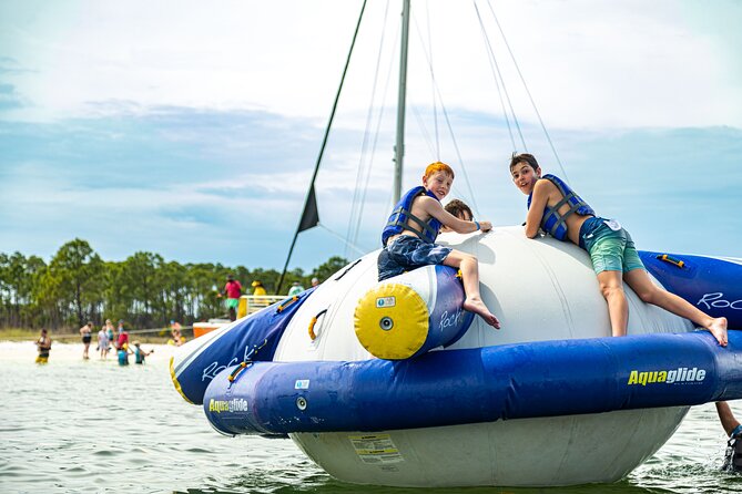 Shell Island Inflatable Adventure Park & Dolphin Sightseeing Tour - Entering Shell Island: Inflatables, The Rockit, and a Built-In Playground