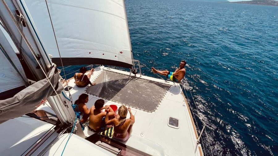 Stintino: Half-day catamaran tour to La Pelosa with aperitif - La Pelosa beach swim: turret views and the classic Stintino moment