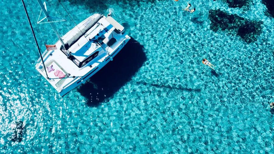 Stintino: Half-day catamaran tour to La Pelosa with aperitif - Meeting at the rightmost pier: getting on board without stress