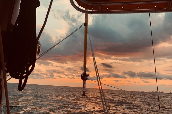 Sunset Dolphin Sail Aboard the Footloose Catamaran - The Sunset Part: How the Crew Shapes Your Views