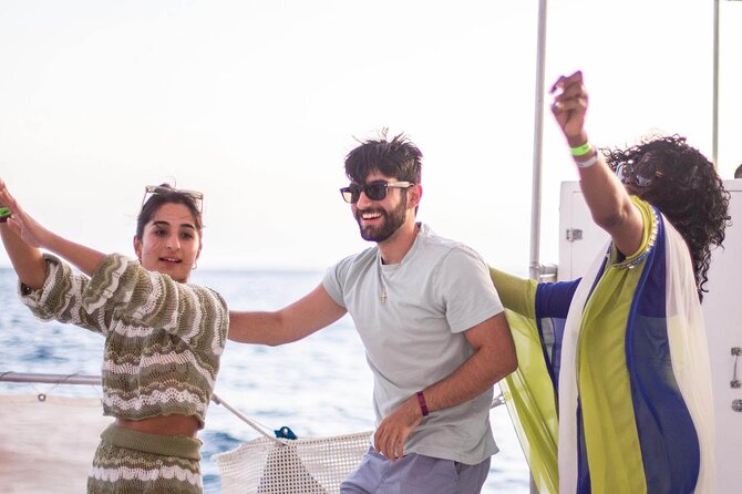 Sunset Sail Party Cruise on the Pez Gato - Your Route: Pelican Rock, Lover’s Beach, and Land’s End Photo Time