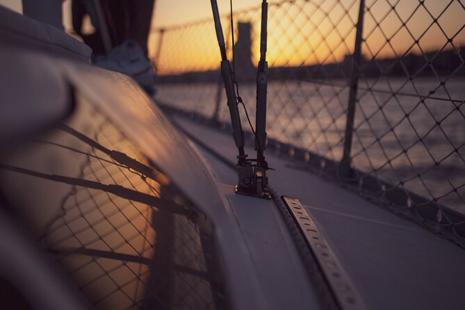 Sunset sailboat tour in Lisbon with green wine - Passing under the bridge: get ready for close-up views