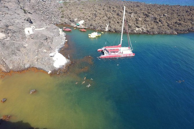 Sunset Sailing Catamaran Cruise in Santorini with BBQ and Drinks - Watching an Ancient Lighthouse From Sea Level