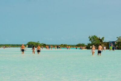Sunset Sailing Tour in Bacalar with Outdoor Bar and Lunch - Stop 1 at Canal de los Piratas: turquoise water and your first round