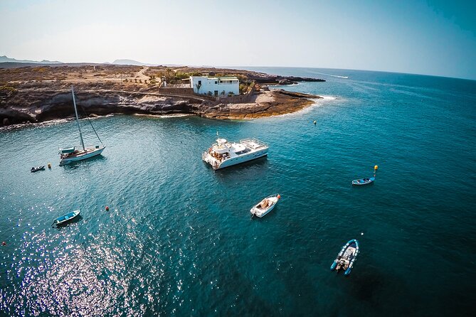Tenerife Sunset Catamaran tour with transfer - Food and Drinks included. - What you get onboard: Wi-Fi, restroom, and AC when you’re waiting