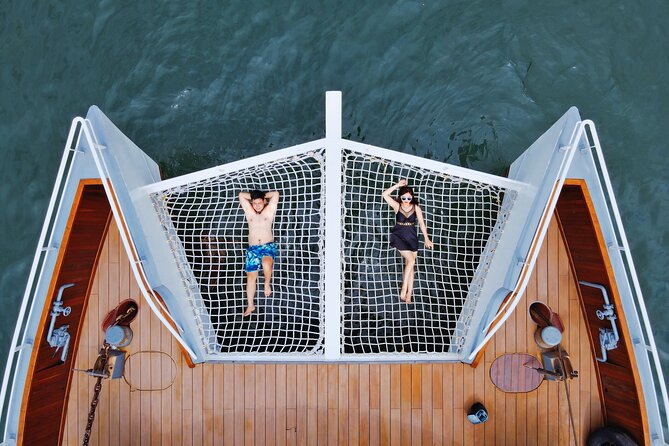 The Halong Catamaran Premium Cruise - Lan Ha Bay Cruise Trip - Sunset ceremony: tea, fruit, little cakes, then back to Hanoi