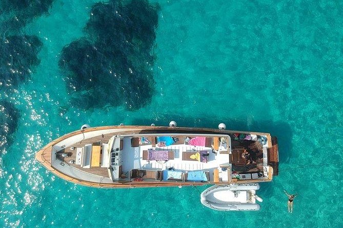 Tour of Ischia Island with Motor Yacht Rocca Corsa - Baia di San Montano Lunch: Seafood, Wine, and Captain-Baked Sfogliatella
