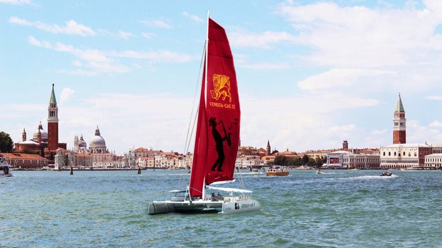 Venice: Lagoon Catamaran Cruise with Music and Drinks - Crossing the turquoise lagoon toward Lido: wide views and a different Venice mood