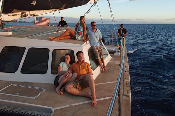 Waikoloa Signature Catamaran Sunset Sail - Kohala–Kona coastline views: black lava, turquoise water, and turtles