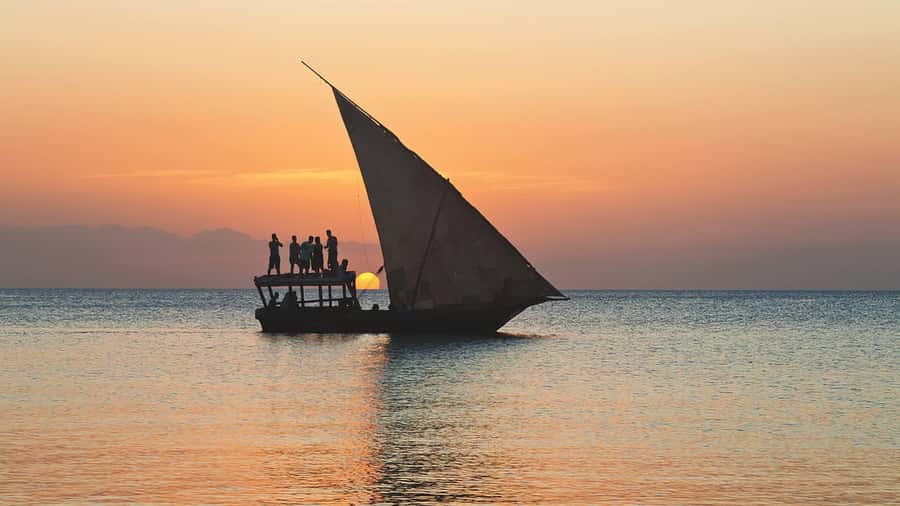 Zanzibar: Sunset Dhow Cruise - The on-water plan: photo stop, swim time, then sunset